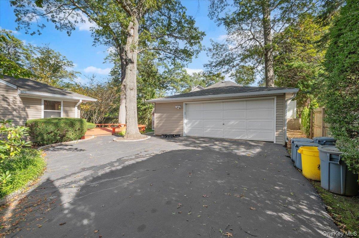 1109 Round Swamp Road Old Bethpage, NY 11804 - Photo 43 of 50 a view of a house with large outdoor space and a tree
