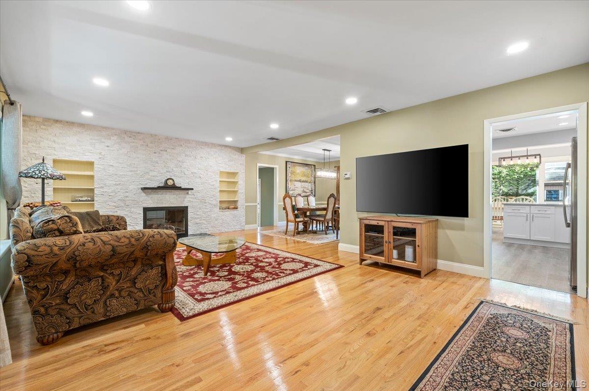 1109 Round Swamp Road Old Bethpage, NY 11804 - Photo 7 of 50 a living room with furniture and a flat screen tv