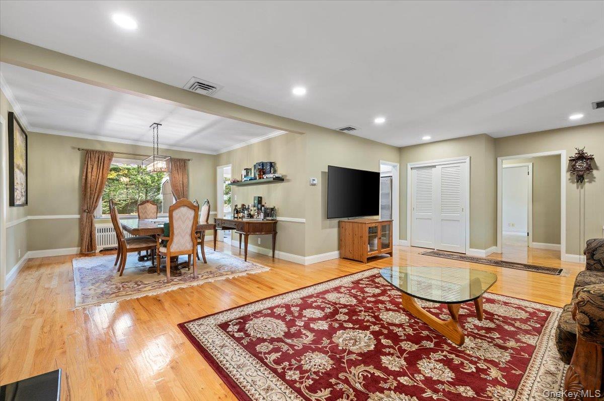 1109 Round Swamp Road Old Bethpage, NY 11804 - Photo 9 of 50 a living room with furniture and a flat screen tv