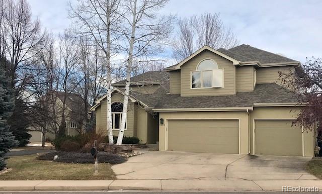 5659 College Place Boulder, CO 80303 - Photo 1 of 27 a front view of a house with yard and trees