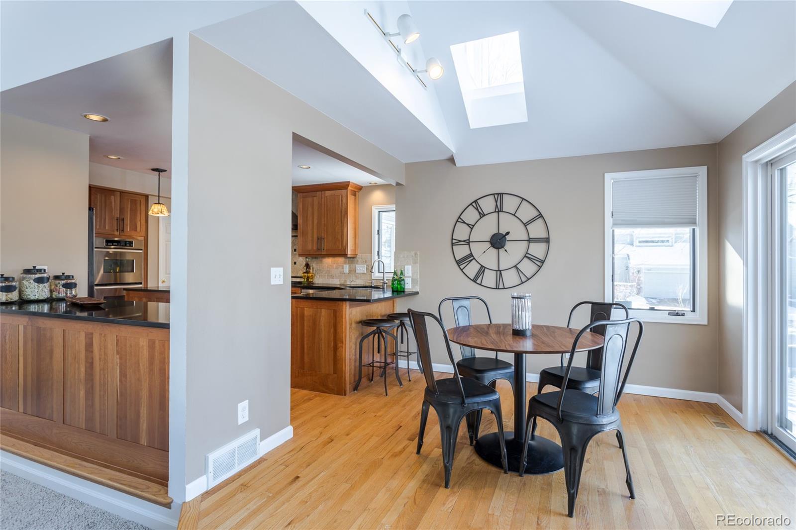 5659 College Place Boulder, CO 80303 - Photo 11 of 27 a view of a dining room with furniture window and wooden floor