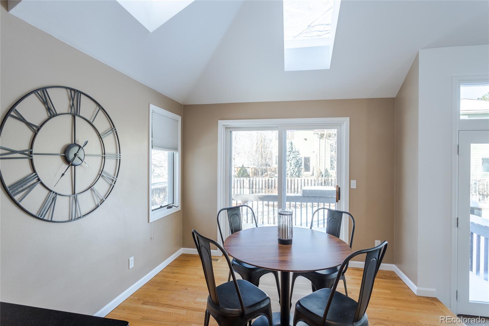5659 College Place Boulder, CO 80303 - Photo 12 of 27 a view of a dining room with furniture window and wooden floor