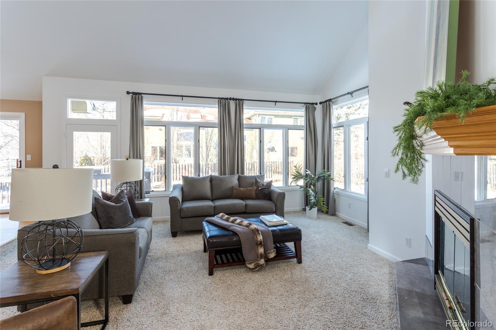 5659 College Place Boulder, CO 80303 - Photo 15 of 27 a living room with furniture and a large window