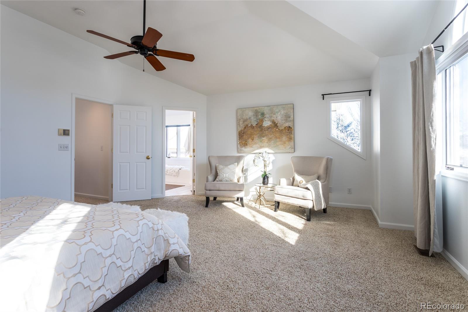 5659 College Place Boulder, CO 80303 - Photo 19 of 27 a spacious bedroom with a bed couch and window