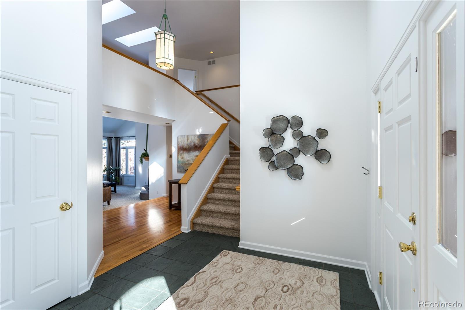 5659 College Place Boulder, CO 80303 - Photo 2 of 27 a view of entryway and hall with wooden floor
