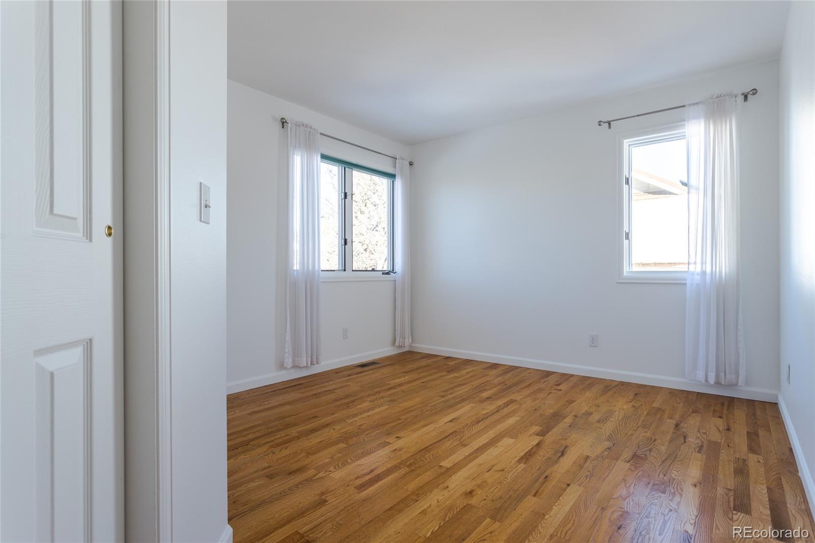 5659 College Place Boulder, CO 80303 - Photo 22 of 27 a view of empty room with wooden floor