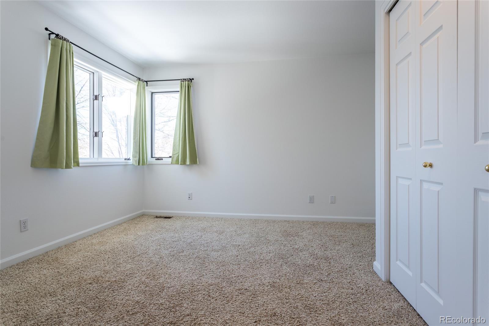 5659 College Place Boulder, CO 80303 - Photo 23 of 27 an empty room with windows