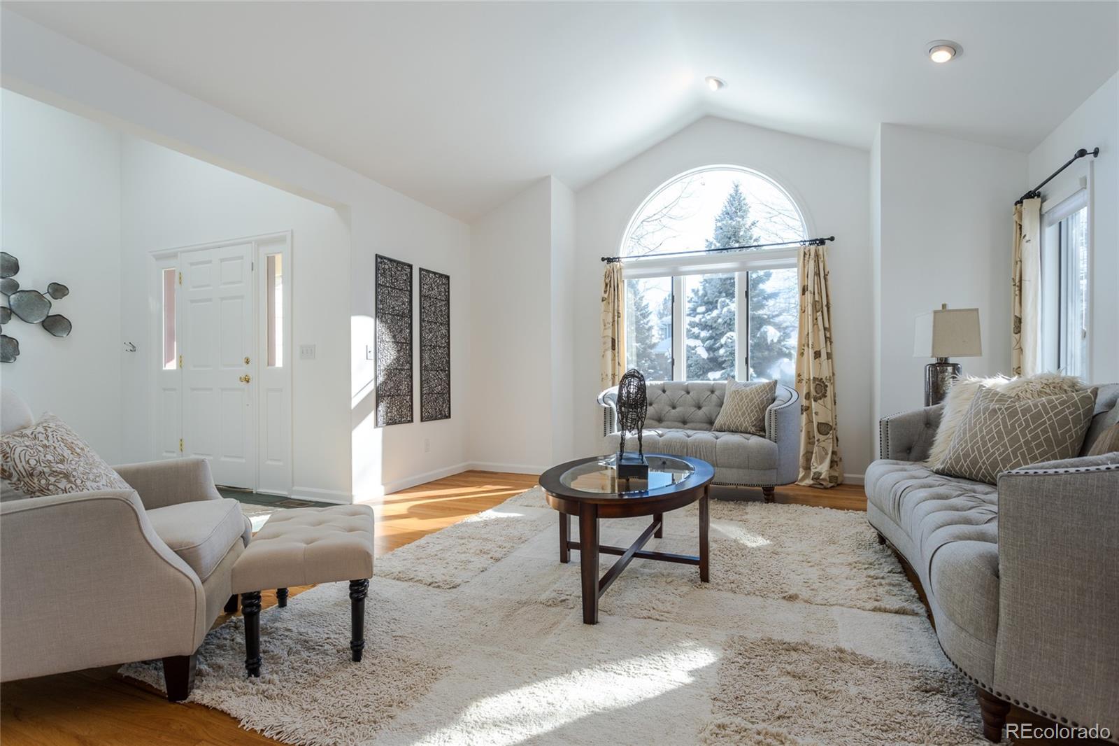 5659 College Place Boulder, CO 80303 - Photo 3 of 27 a living room with furniture and a large window