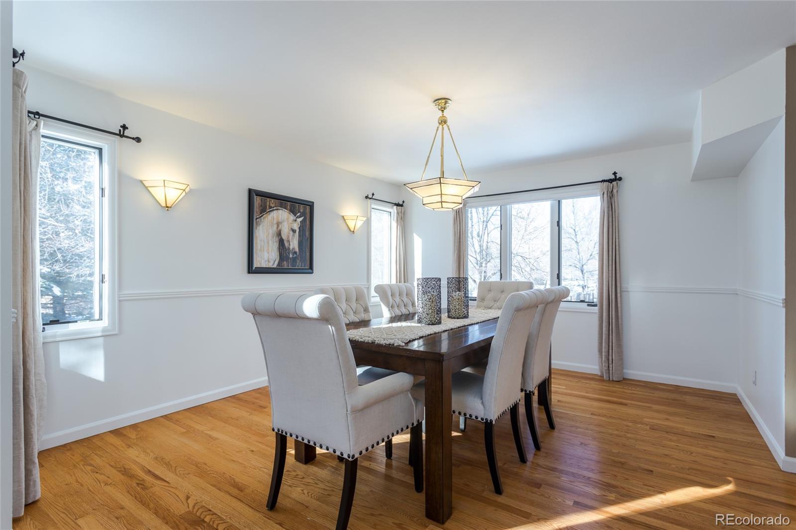 5659 College Place Boulder, CO 80303 - Photo 6 of 27 a view of a dining room with furniture window and wooden floor