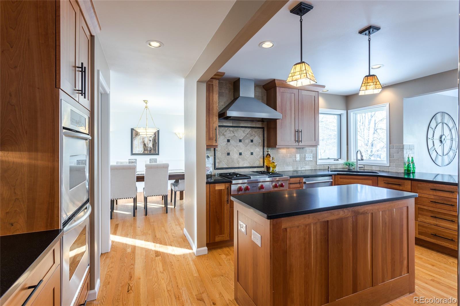 5659 College Place Boulder, CO 80303 - Photo 8 of 27 a kitchen with stainless steel appliances granite countertop a sink a stove and a wooden floors