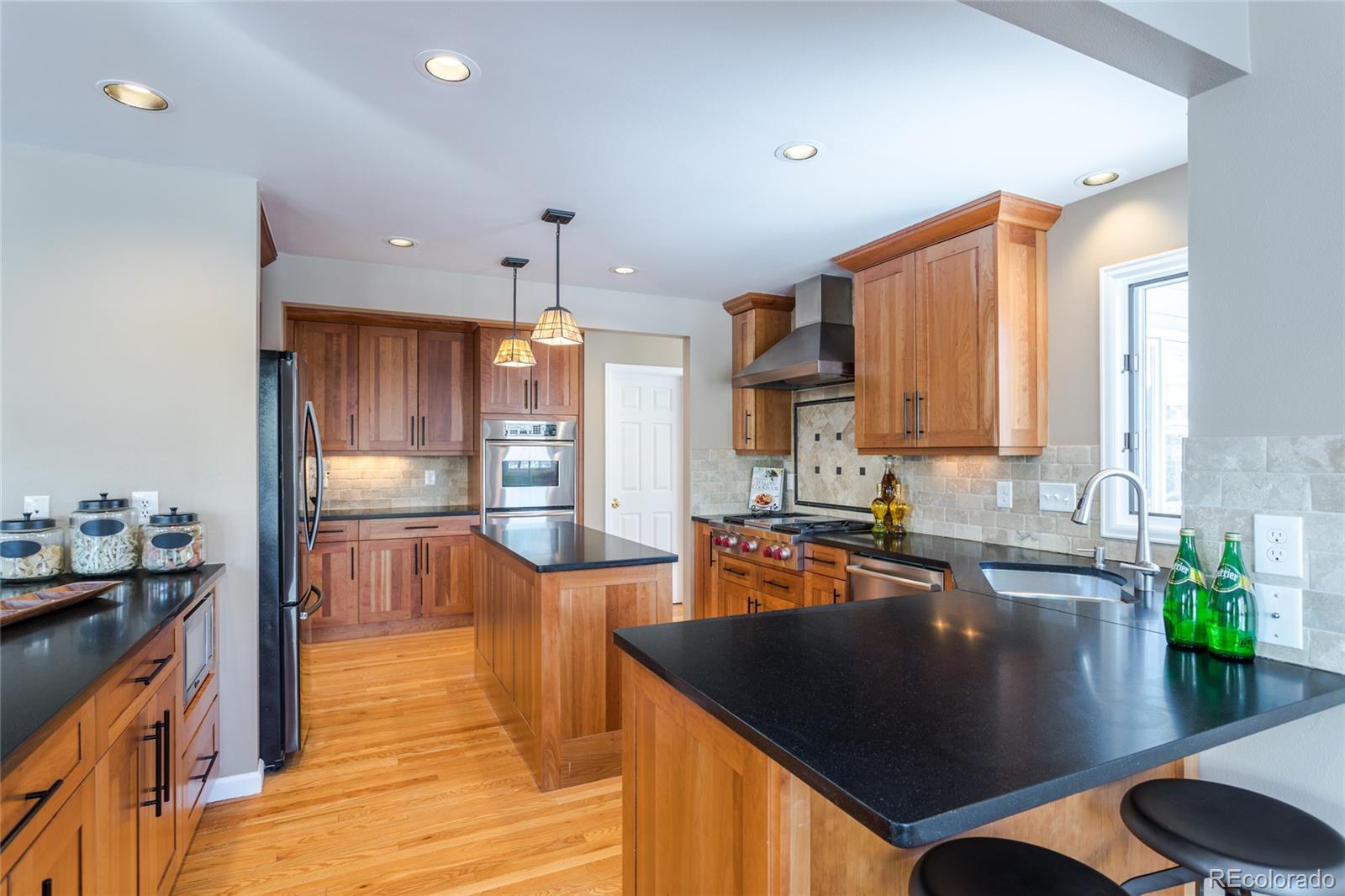 5659 College Place Boulder, CO 80303 - Photo 10 of 27 a kitchen with stainless steel appliances granite countertop a sink a stove and a refrigerator