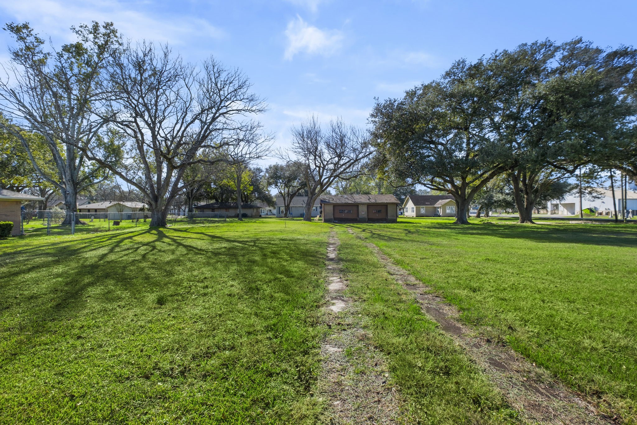 9310 Main Street Needville, TX 77461 - Photo 12 of 27 a view of a park with large trees