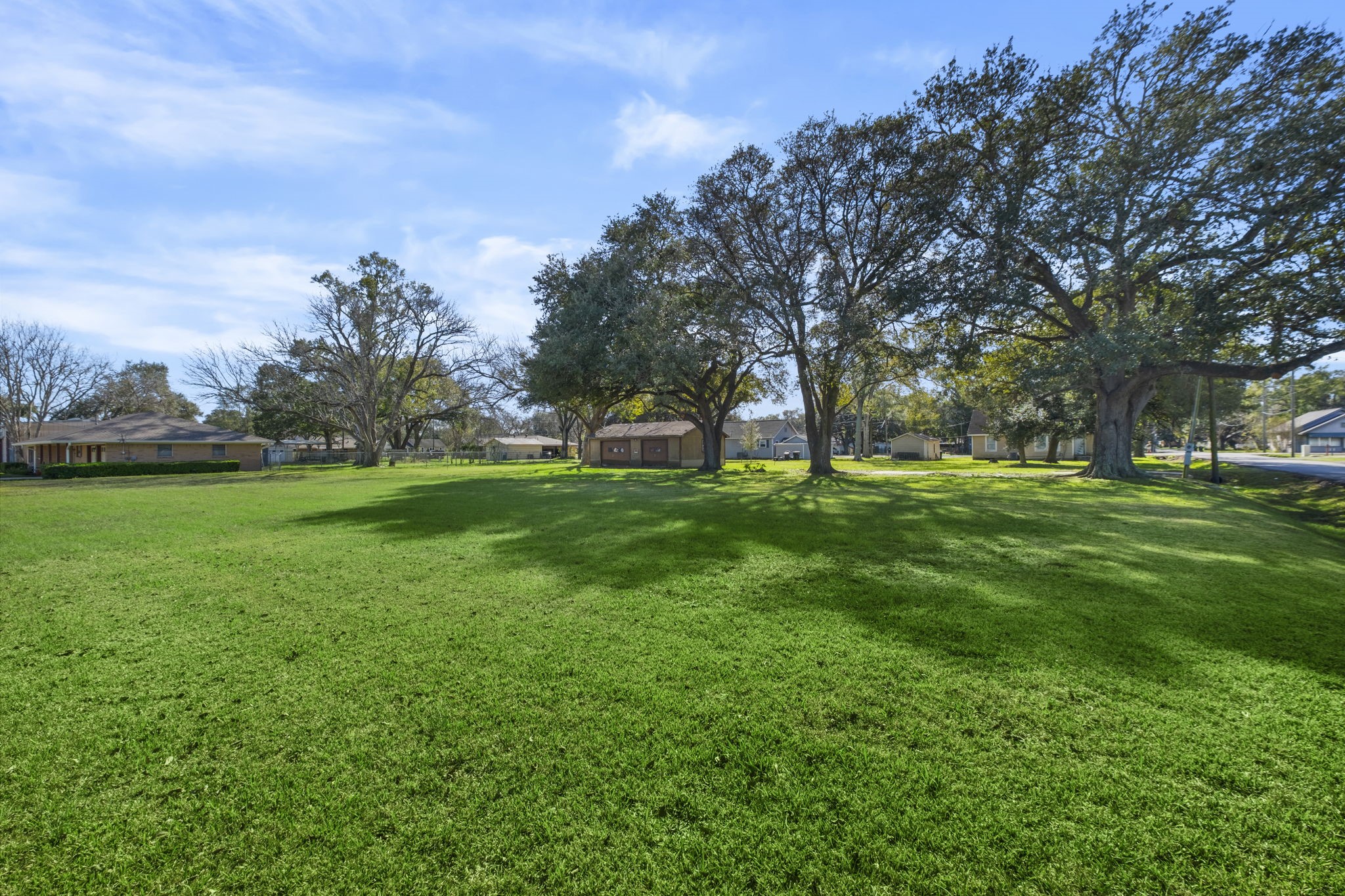 9310 Main Street Needville, TX 77461 - Photo 10 of 27 a view of grassy field with benches