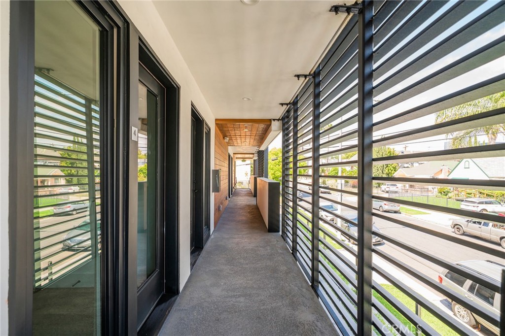 6201 La Mirada Avenue, Unit 7 Los Angeles, CA 90038 - Photo 20 of 20 a view of hallway with a large window and chandelier