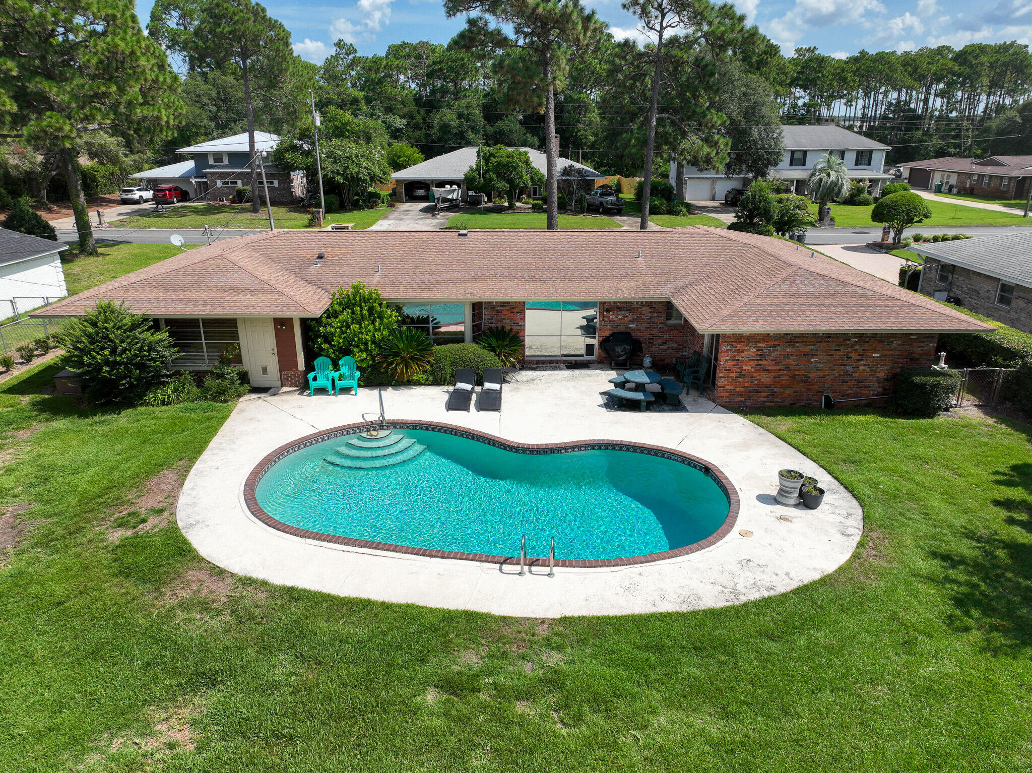 a view of a swimming pool with a garden