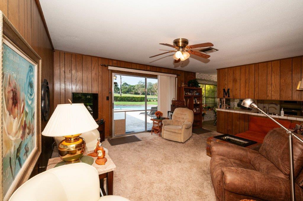 90 Country Club Road Shalimar, FL 32579 - Photo 19 of 41 a living room with furniture and a large window