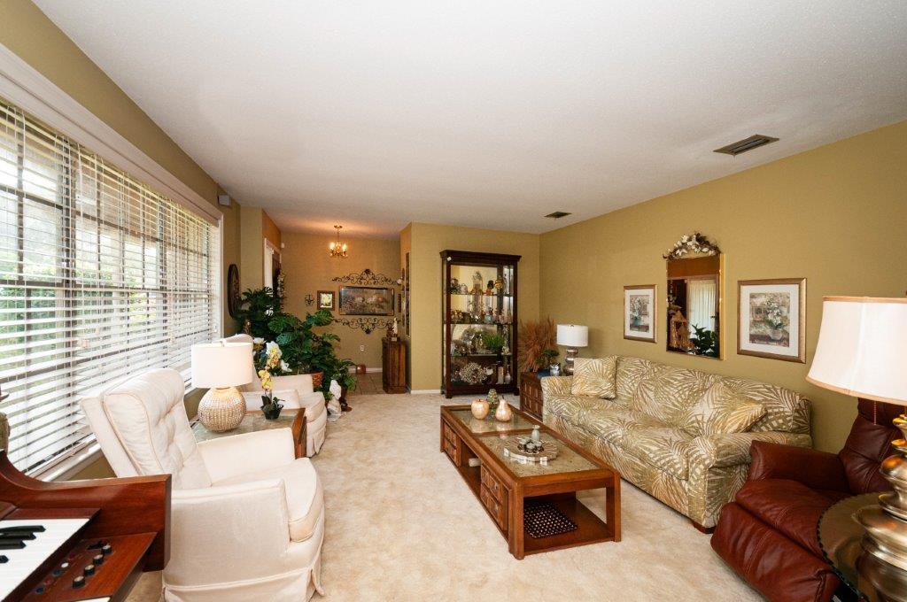 90 Country Club Road Shalimar, FL 32579 - Photo 20 of 41 a living room with furniture and a large window