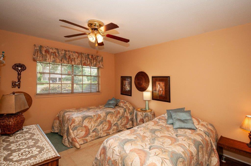 90 Country Club Road Shalimar, FL 32579 - Photo 21 of 41 a bedroom with two beds and a window