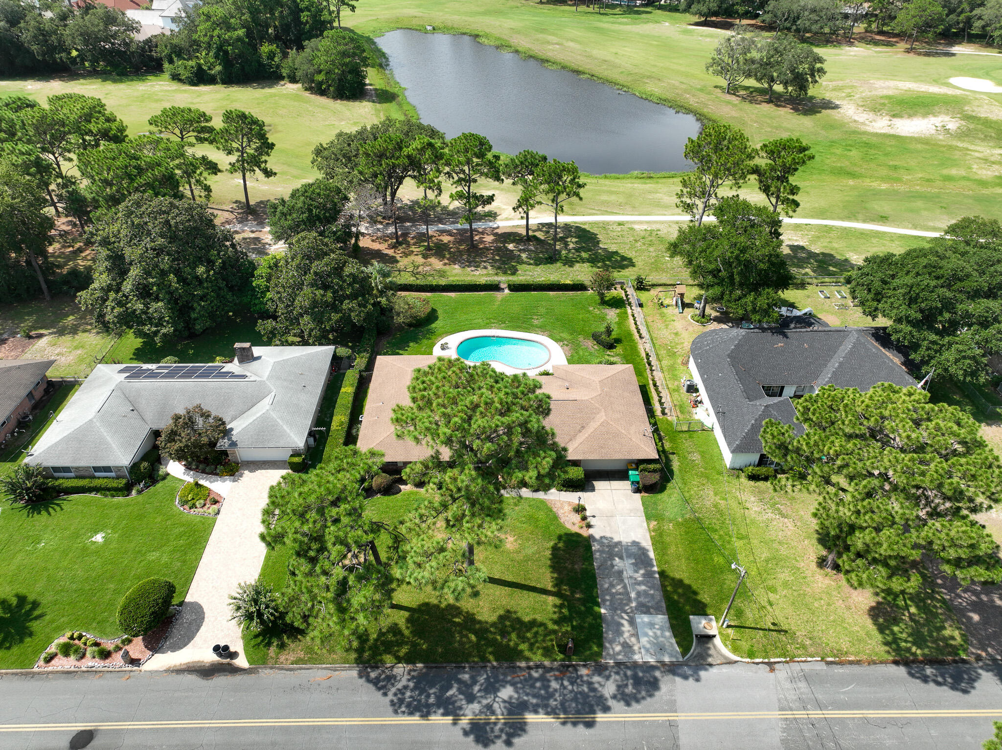 90 Country Club Road Shalimar, FL 32579 - Photo 3 of 41 an aerial view of a house with yard swimming pool and outdoor seating