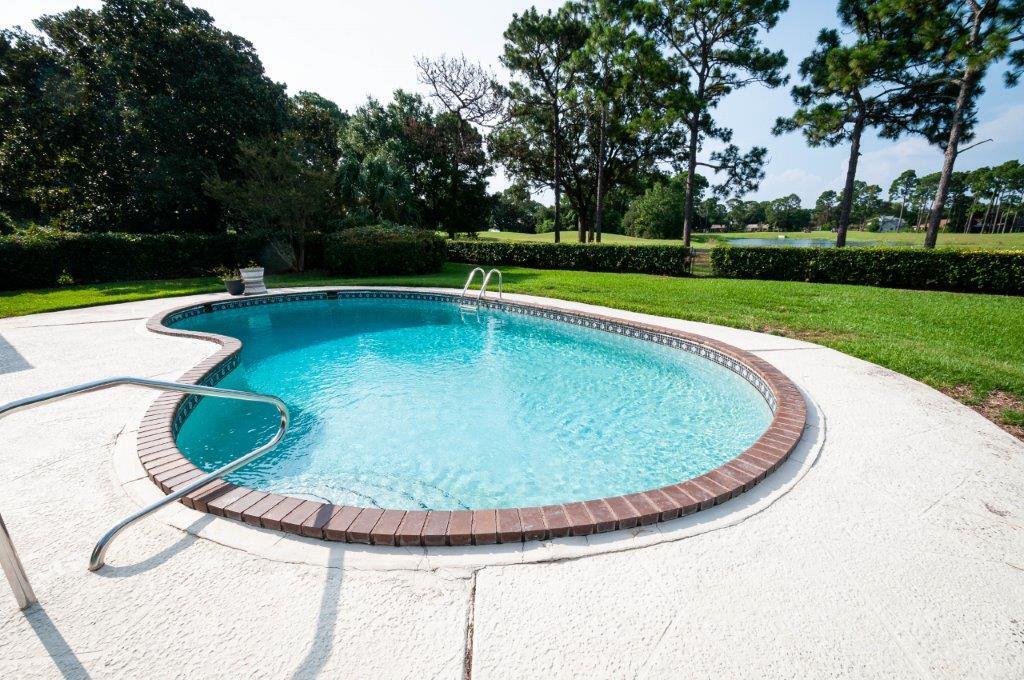 90 Country Club Road Shalimar, FL 32579 - Photo 35 of 41 a view of a swimming pool and a yard