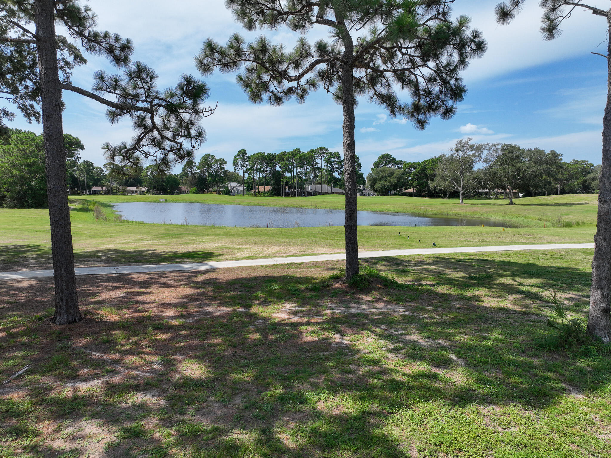90 Country Club Road Shalimar, FL 32579 - Photo 40 of 41 a view of a lake with a yard
