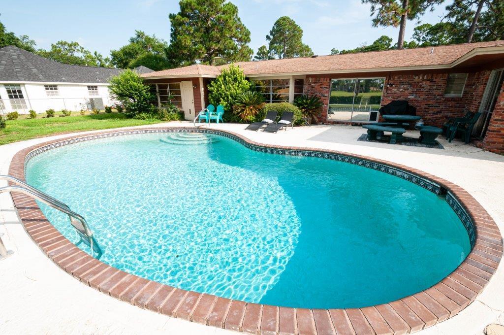 90 Country Club Road Shalimar, FL 32579 - Photo 5 of 41 swimming pool view with a seating space