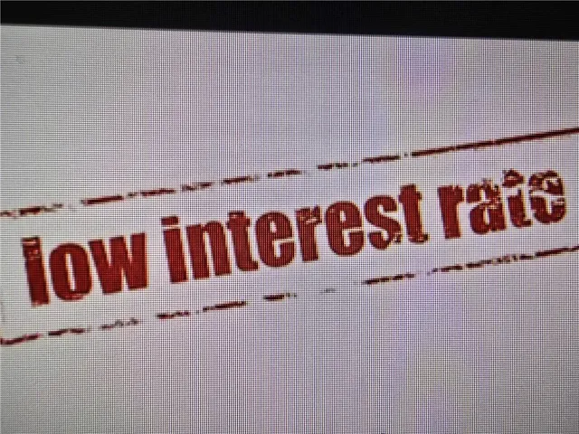 a view of a swimming pool with outdoor seating