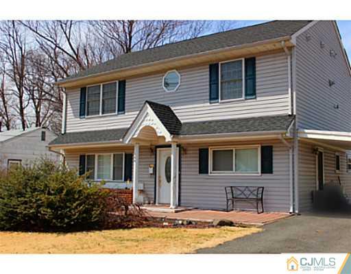166 Winthrop Road Edison, NJ 08817 - Photo 1 of 17 a front view of a house with a yard