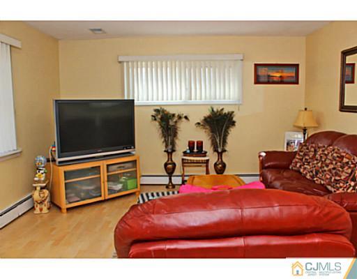 166 Winthrop Road Edison, NJ 08817 - Photo 2 of 17 a bedroom with two beds and a flat screen tv