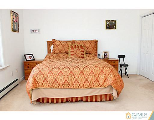 166 Winthrop Road Edison, NJ 08817 - Photo 13 of 17 a bedroom with a bed rug and lamp