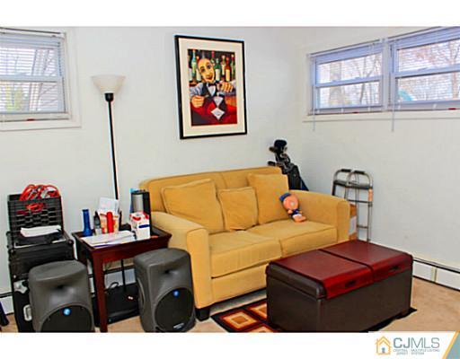 166 Winthrop Road Edison, NJ 08817 - Photo 6 of 17 a living room with furniture a rug and a window