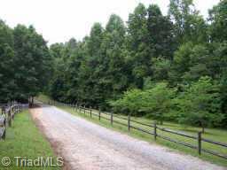 490 River Ridge Lane Lexington, NC 27295 - Photo 8 of 9 Other. View of the main entrance to the property. Almost 28 acres, Yadkin River Frontage, Cabinet Shop, Log Cabin which houses two of the heating sources for the home.