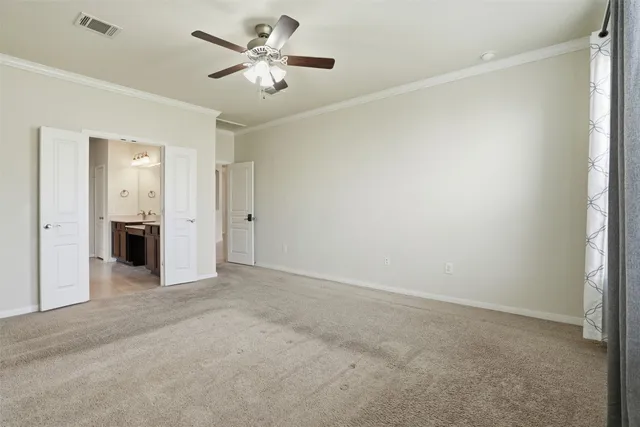 an empty room with a bathroom