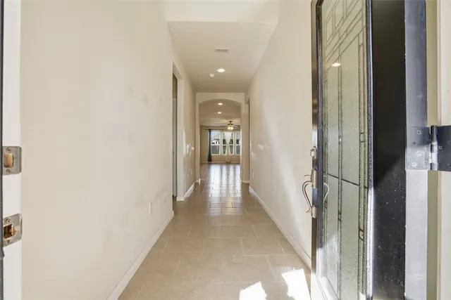 a view of hallway with wooden floor