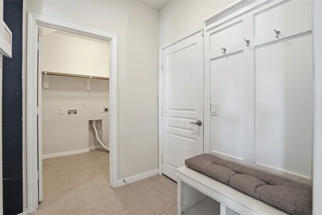 a living room with furniture and a closet