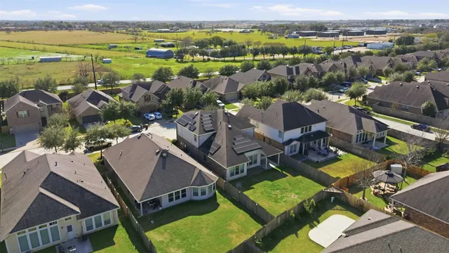 an aerial view of a house with a lake view