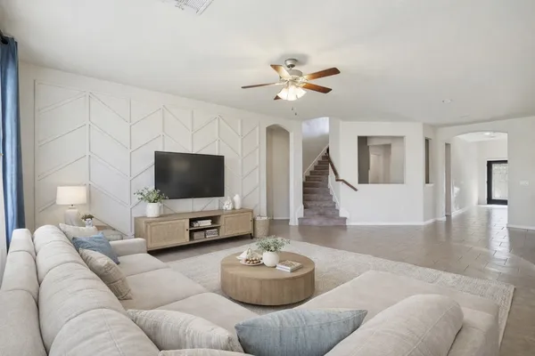 a living room with furniture and a flat screen tv