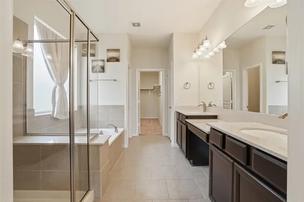 a bathroom with a bathtub and a shower