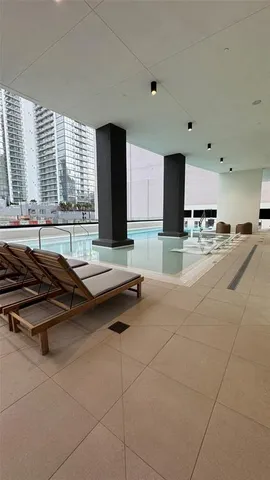 a view of a swimming pool with a terrace