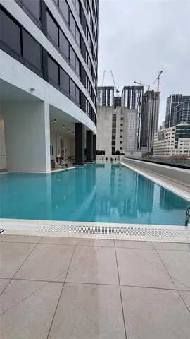 a reading room with furniture and a chandelier