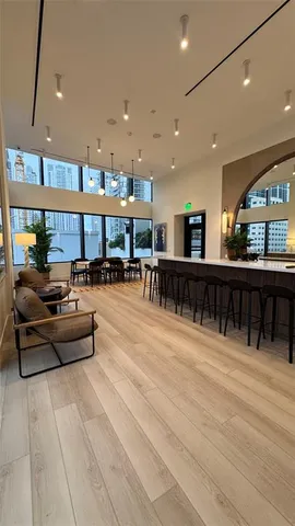 a room with furniture and lots of tables