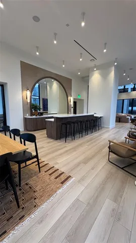 a room with lots of furniture and view of living room