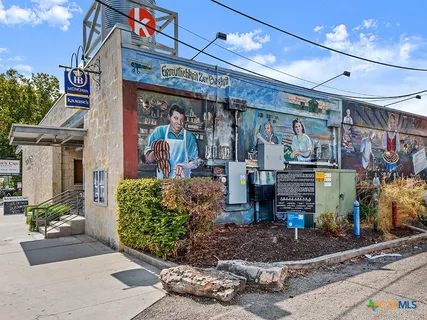 a view of a chairs and table in a patio