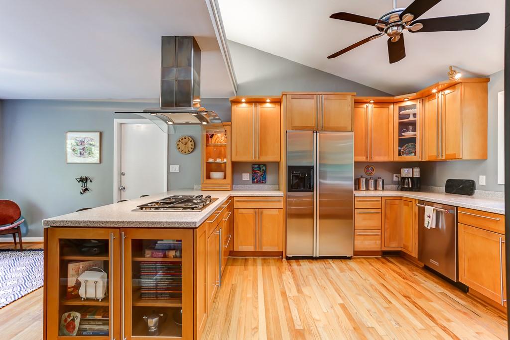 665 Edgewater Trail Sandy Springs, GA 30328 - Photo 1 of 1 THE RENOVATED KITCHEN BOASTS A BUILT-IN RANGE WITH EXHAUST AND GORGEOUS COUNTER TOPS