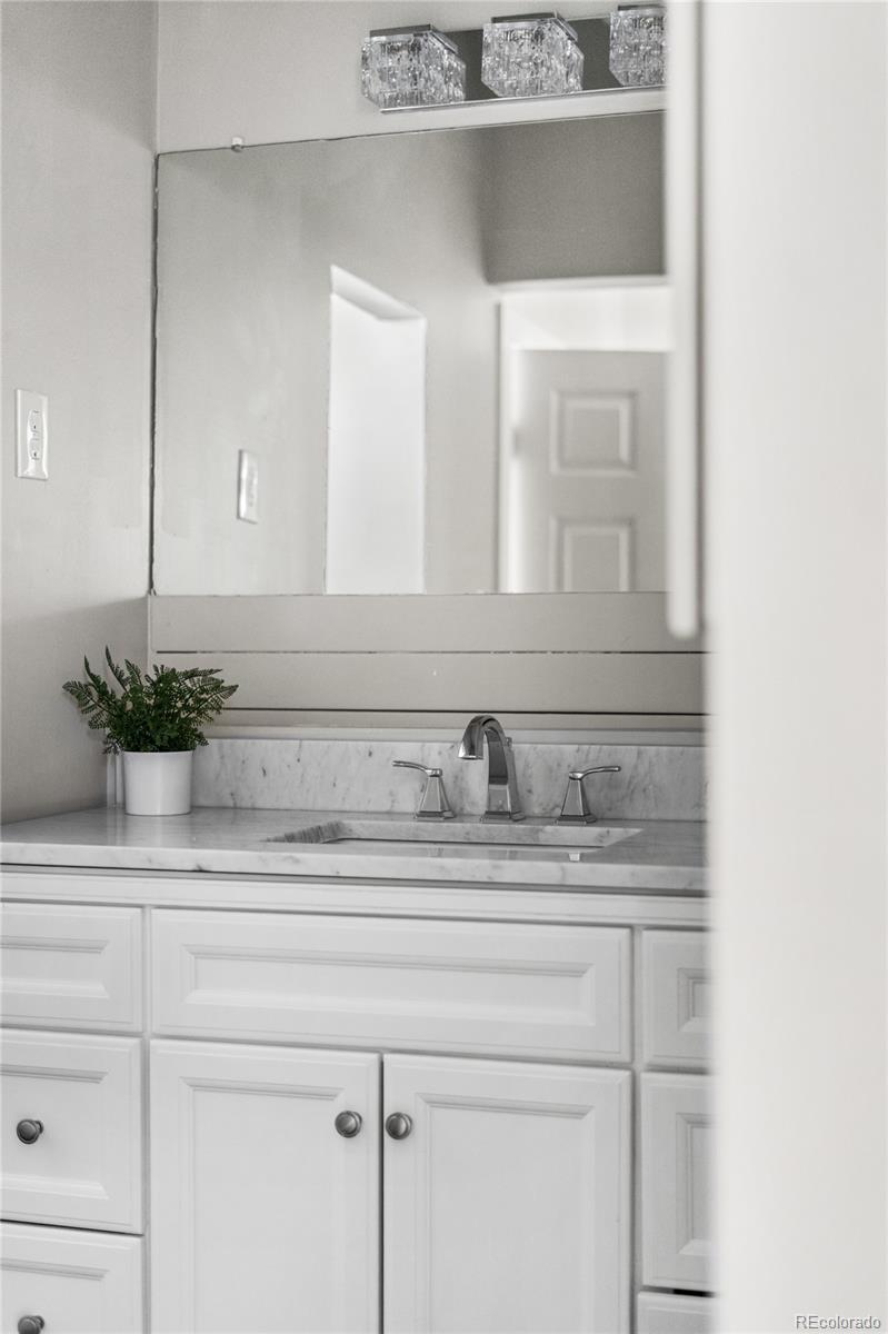 2259 Depew Street Edgewater, CO 80214 - Photo 33 of 46 a bathroom with a sink and a mirror