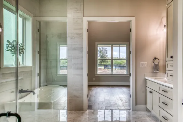 a view of a bathroom from a hallway