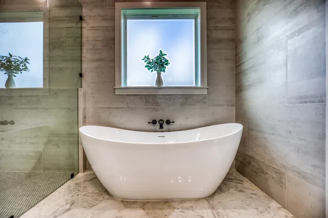 a white bath tub sitting in a bathroom