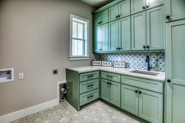 a kitchen with cabinets a window and a sink