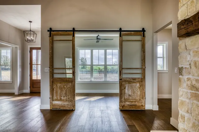 a view of front door with wooden floor