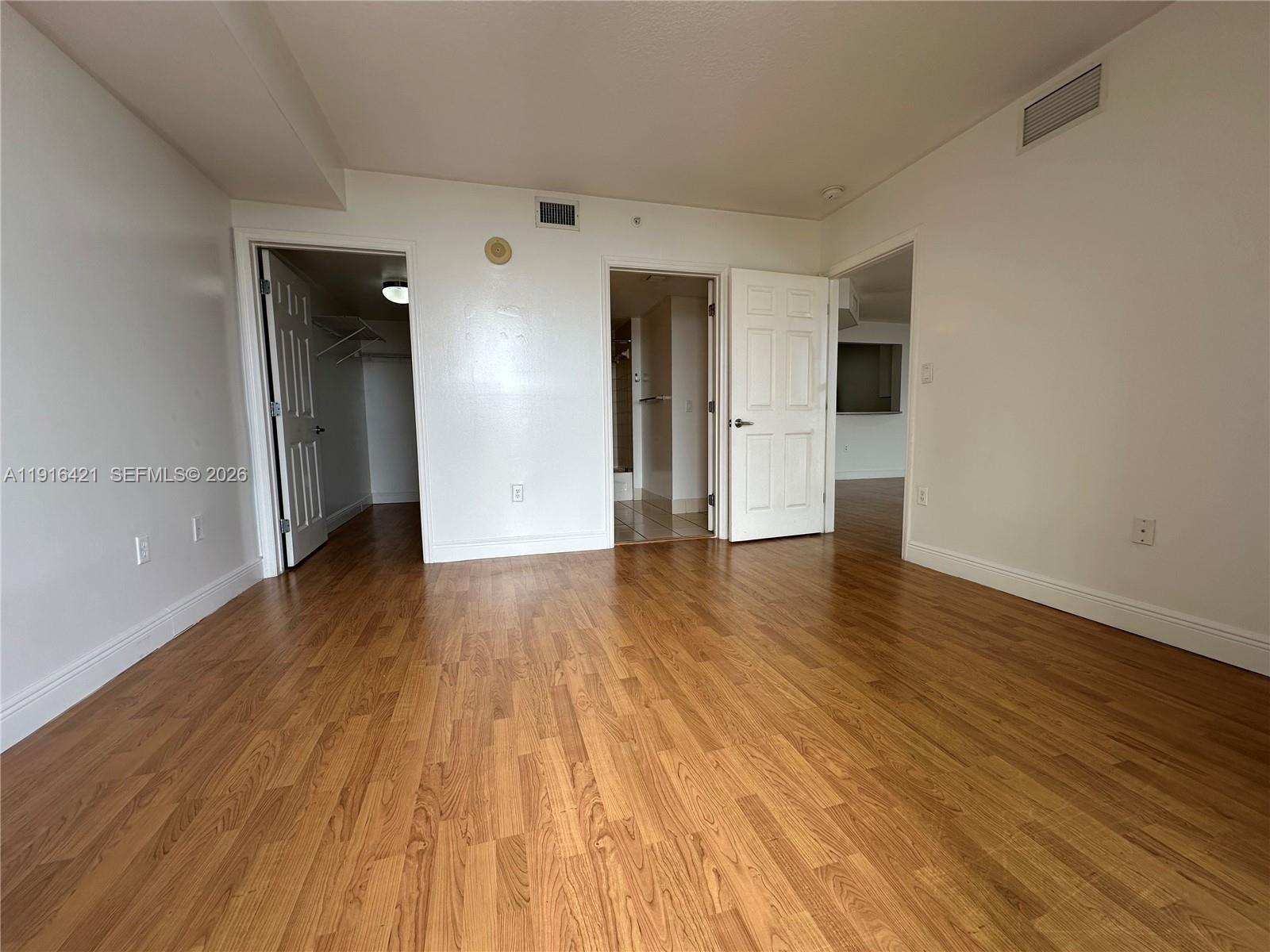 900 Southwest 8th Street, Unit 1010 Miami, FL 33130 - Photo 20 of 27 a view of empty room with wooden floor